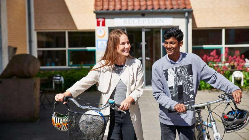 two backpackers with bicycles